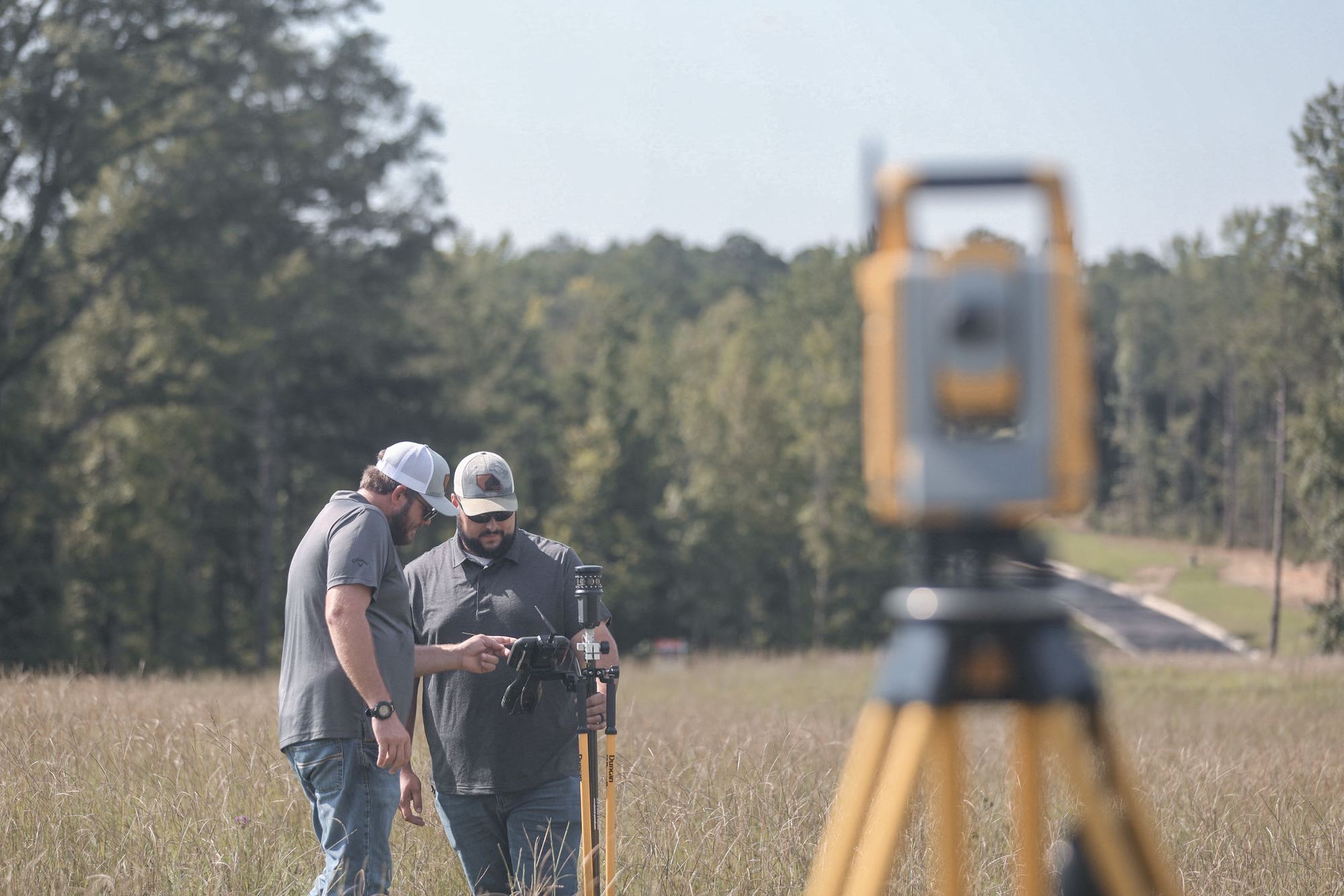 Samford Group survey crew running a boundary survey with a robotic total station